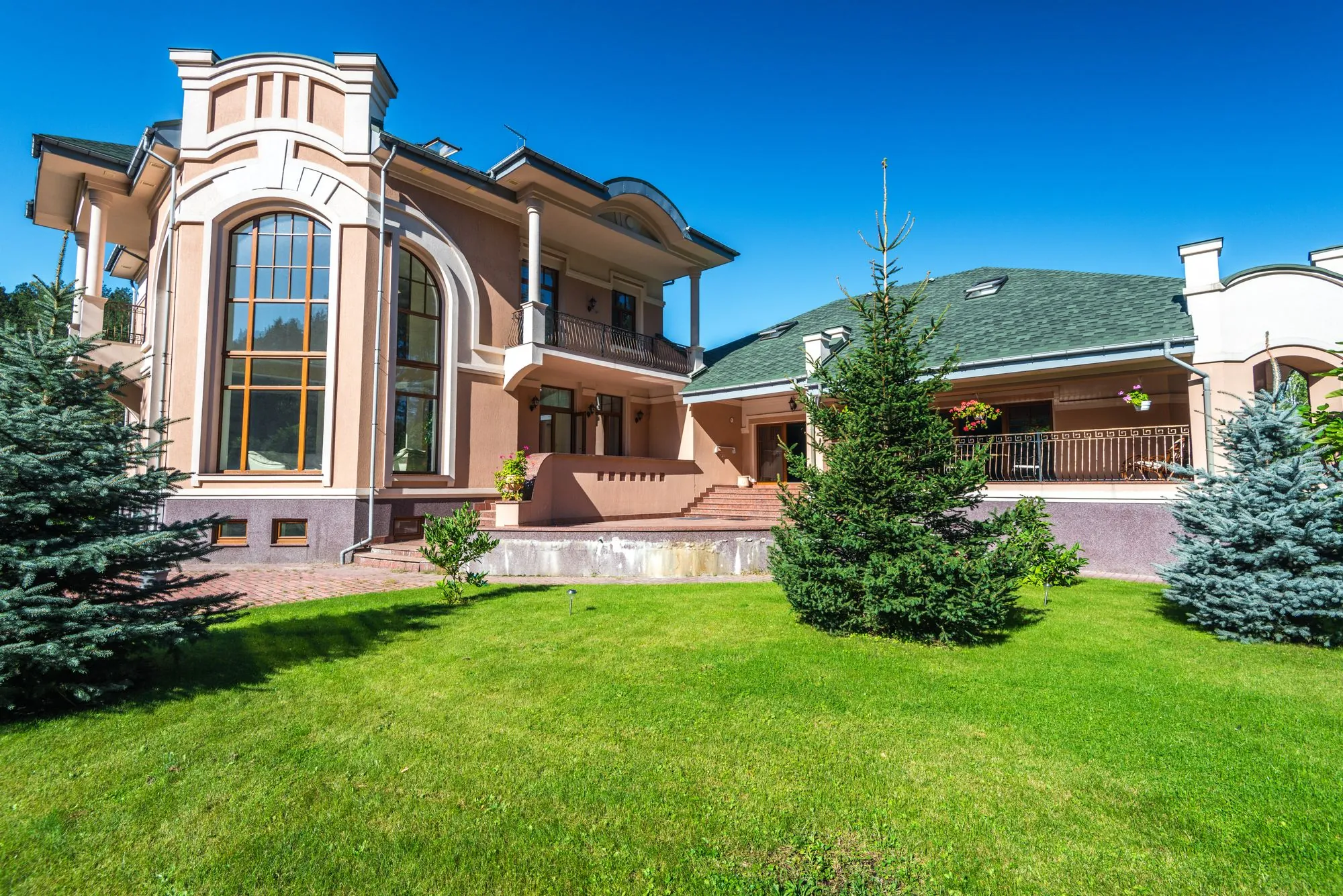 A large residential house exterior with a pitched roof