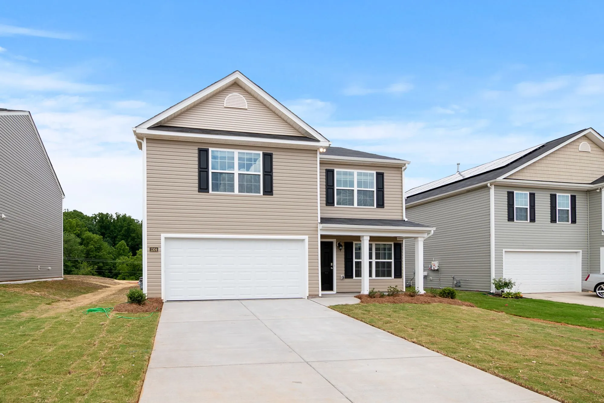 A two-storey suburban house with an attached garage
