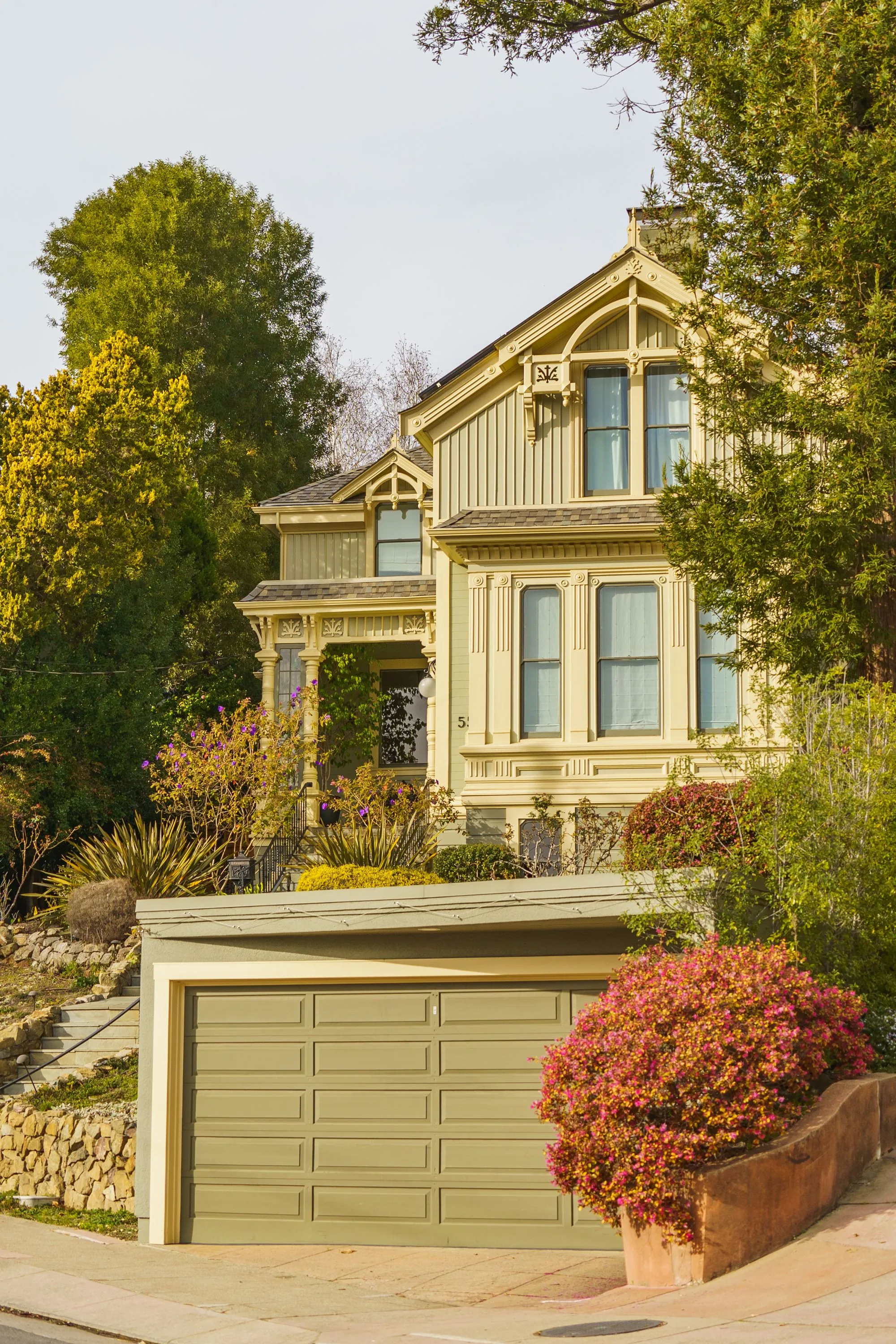 A painted clapboard house with ornate trim